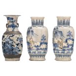 A pair of Chinese grey celadon ground blue and white decorated stoneware vases, relief decorated