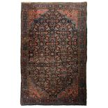 An Oriental woollen rug, decorated with floral motifs, 131 x 206 cm