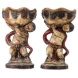 A pair of polychrome oak plant stands with putti, H 76 cm