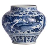 A Chinese blue and white jar, all over decorated with fish in a lotus pond, H 28 cm