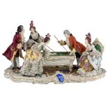 A Rococo style polychrome decorated Saxony porcelain group, depicting a gallant scene in a
