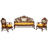 A large Queen Anne inspired salon suite in richly carved exotic hardwood and decorated with dream