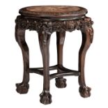 A Chinese richly carved hardwood soccle with a marble top, H 71 - ø 55 cm