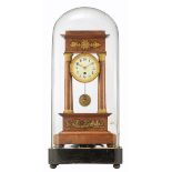 A Napoleon III mahogany and ebony portico clock with gilt bronze mounts, under a glass bell jar,