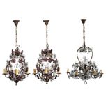 A pair of floral decorated brass chandeliers with flower shaped white and coloured cut glass;