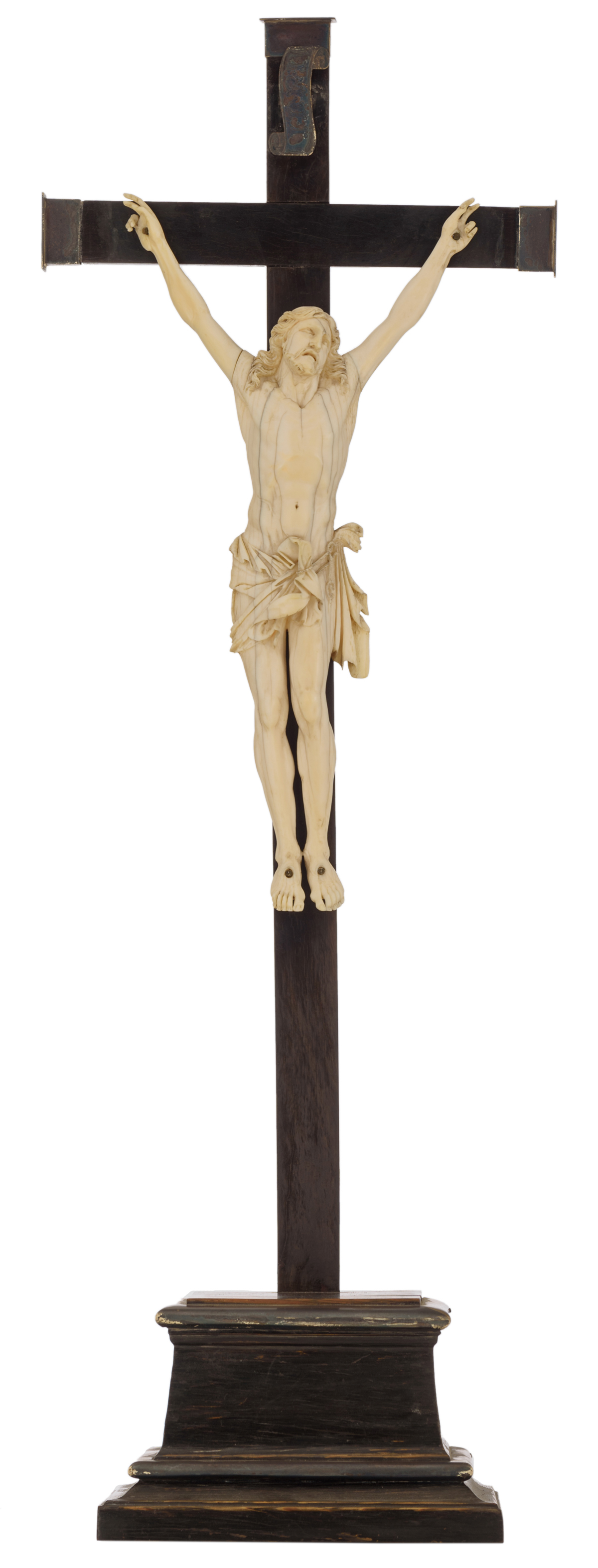 An ivory corpus on a ebonised wooden base, with silver mounts, no visible hallmarks but tested on