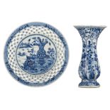 A Chinese blue and white decorated plate with an openworked rim, the centre decorated with a 'vase