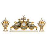 A fine neoclassical gilt and silver plated bronze three-piece garniture on Carrara marble bases, the