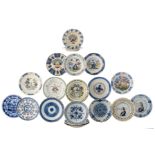 An important and interesting lot of 19 Dutch Delftware plates, six of them blue and white decorated;
