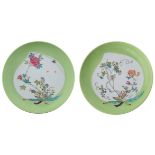 Two Chinese lime green glaze and famille rose chargers, the peach shaped roundels decorated with a