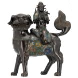 A Chinese champlevé enamel bronze figure, depicting a Guanyin, seated on a Fu lion, marked, 19th/