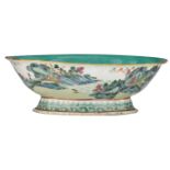 A Chinese famille rose footed plate with lobed edge, decorated with a river landscape, the inside
