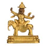 A Sino-Tibetan gilt bronze Tantric deity as Dorje Legpa on an elephant, with polychrome details, H