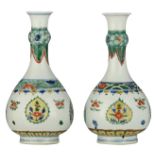 Two nearly identical Chinese famille verte garlic neck bottle vases, decorated with lingzhi,