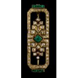 An 18ct white gold Art Deco period brooch set with brilliant cut diamonds and emeralds (old cut),