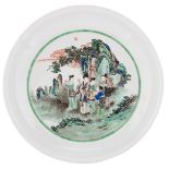 A Chinese famille verte plate, the well decorated with a female Immortal holding a ruyi sceptre with