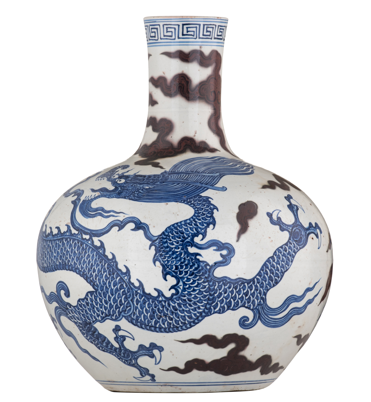 A Chinese cobalt blue and copper red bottle vase, decorated with a dragon amongst clouds, H 41 cm