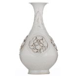 A qingbai glazed pear-shaped 'yuhuchun' bottle with applied floral relief decoration depicting the
