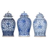 Three Chinese blue and white floral decorated pots and covers, 18th/19thC, H 43,5 - 45 cm