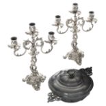A pair of German silver Rococo Revival candlesticks, marked 'Gebr. Friedlander', 800/000; added a