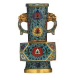 A small Chinese floral decorated cloisonné bottle vase, the handles with lion's head, with a