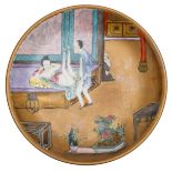 A Chinese polychrome and gilt decorated dish, the well with an erotic scene, with a Daoguang seal