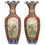 A pair of imposing Japanese brocade Imari ground vases, the roundels decorated with peacocks on