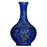 A Chinese blue ground and gilt decorated bottle vase, with birds on flower branches, the shoulder