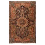 An Oriental woollen prayer rug, decorated with floral motifs and a central medallion, 128 x 203 cm