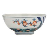 A Chinese doucai bowl with a floral design, with a Kangxi mark, H 8 - ø 18,5 cm