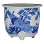 A Japanese blue and white jardiniere, overall decorated with a peacock and flower branches, H 37,5 -