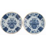 Two Dutch Delftware plates with a flower basket chinoiserie decoration, marked 'De Bijl', ø 36 cm