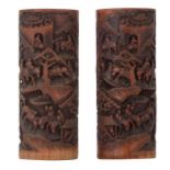 A pair of Chinese richly carved bamboo brushpots, depicting travelers on their way to a city, H 35,5