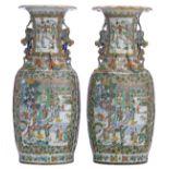 Two large Chinese Canton vases, richly decorated with flowers and the one hundred antiquities, the