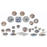 A lot of Chinese Imari porcelain items, consisting of dishes, cups, salt cups, saucers and fruit