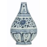 A Chinese blue and white floral decorated Ming type bottle vase, 17thC, H 21,5 cm