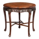 An Oriental richly carved hardwood occasional table, H 71 - ø 80 cm