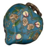 A Chinese peach shaped cloisonné box and cover, the outside with the symbolic nine peaches relief