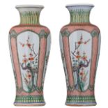 A pair of Chinese famille verte vases, the roundels decorated with flower branches representing