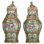 Two Chinese famille rose Canton covered vases, the roundels decorated with court scenes, with Fu