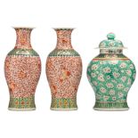 A pair of Chinese famille verte iron-red vases, allover decorated with lotus scrolls; added a