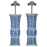 A pair of Chinese blue and white floral decorated yenyen vases, marked Kangxi and period, mounted as