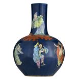 A Chinese blue ground and famille rose bottle vase, decorated with the Eight Immortals, with a