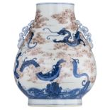 A Chinese cobalt blue and copper red hu vase, overall decorated with dragons among clouds, with a