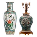 A Chinese turquoise ground and famille verte floral decorated baluster shaped vase, the roundels