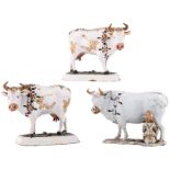 A pair of 18thC Dutch Delftware cows with polychrome cold painted decoration, added a single ditto