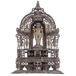 A bronze Jain altar shrine with a standing deity in the niche