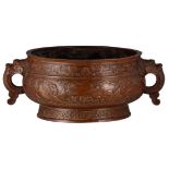 A Chinese archaic red copper gui incense burner with dragon shaped handles, the central frieze