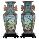 A pair of hexagonal brass cloisonné vases, decorated with cranes, on two matching bases, marked