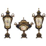 A three-piece Limoges mantle garniture in the Sèvres manner, with gilt bronze mounts, bleu royale